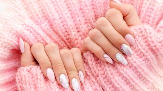 Female,Hands,Manicure,Close,Up,View,On,Pink,Knitted,Sweater